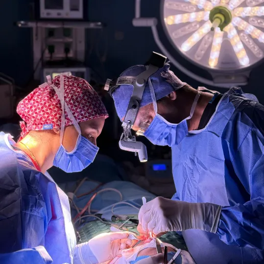 Surgeons performing complex surgery relevant to medical negligence claims