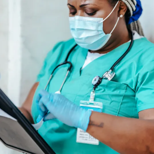 Nurse reviewing patient information relevant to a medical negligence claim