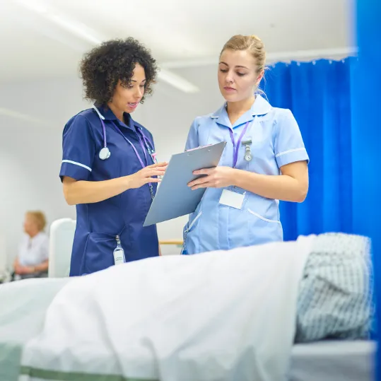 Nurses reviewing patient records relevant to medical negligence claims