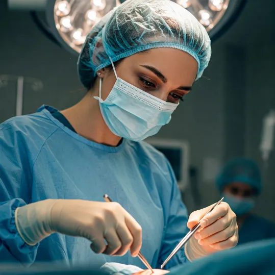Surgeon performing a delicate procedure relevant to medical negligence