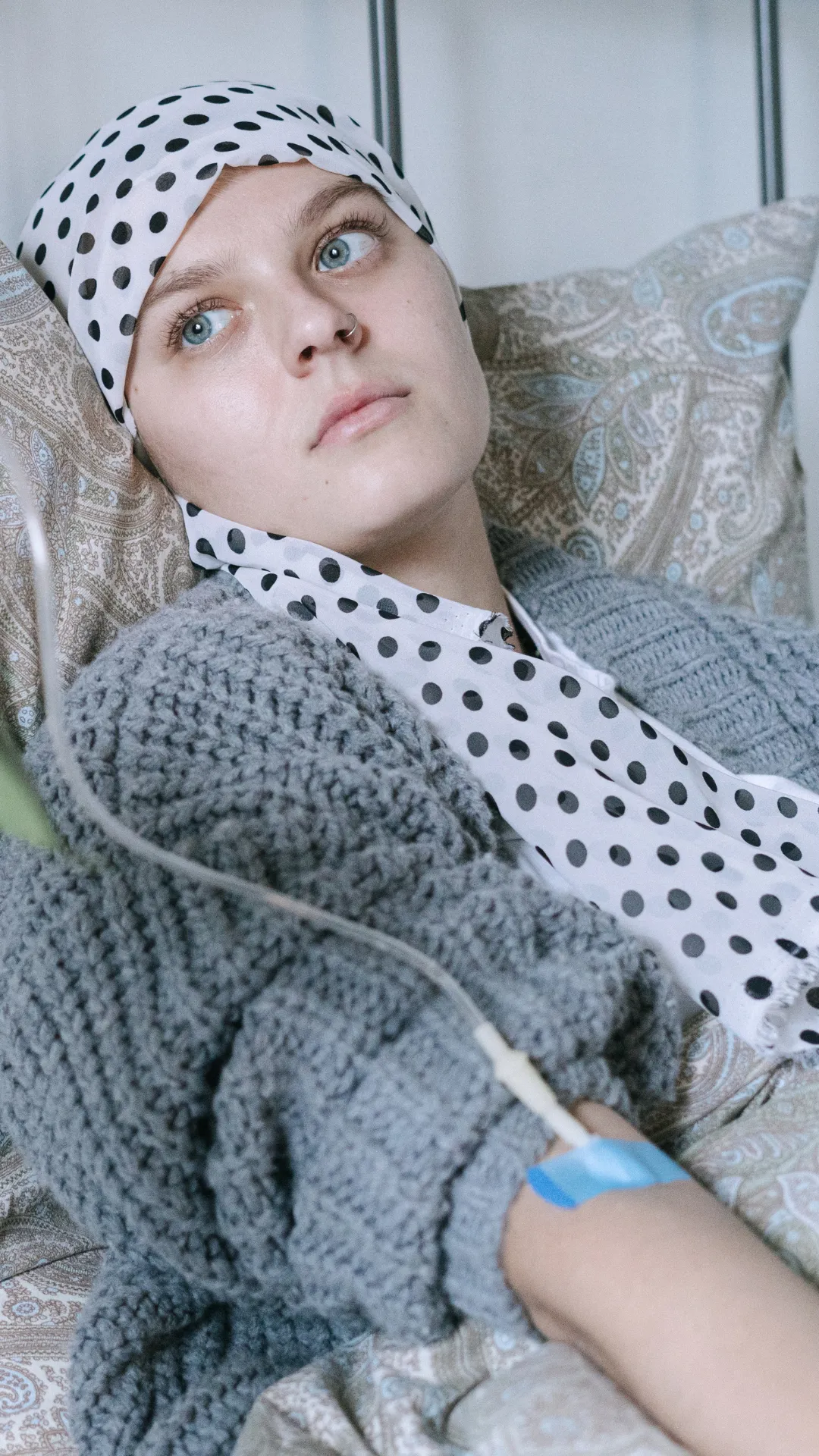 Patient with an IV line resting in bed, representing hospital-acquired infection and sepsis claim support.