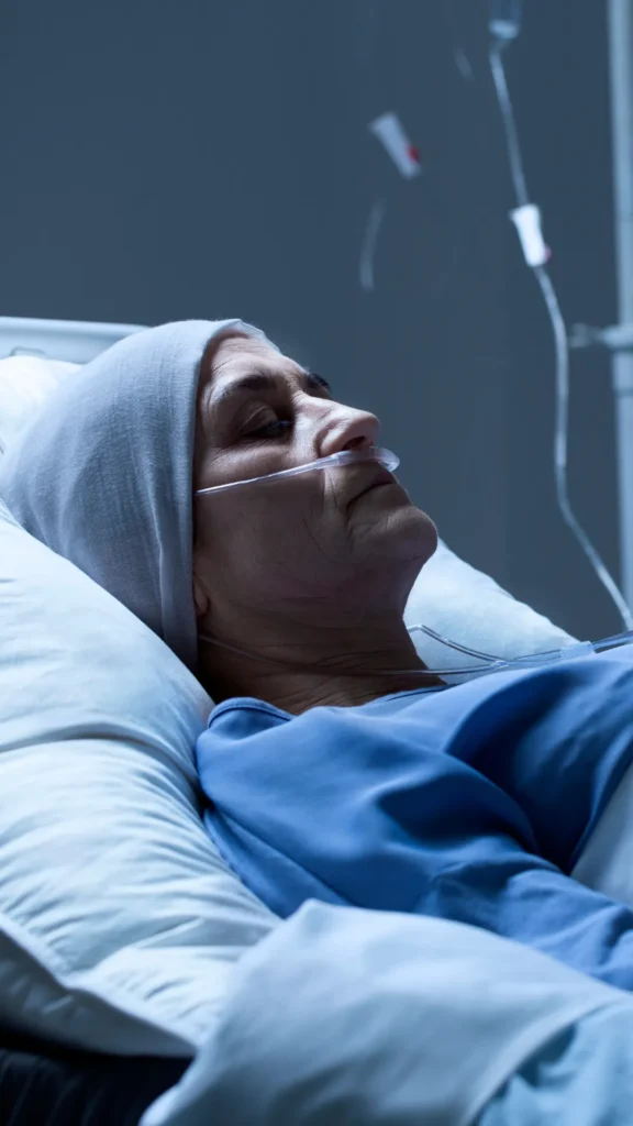 Elderly woman lying in a hospital bed with an oxygen cannula, representing serious patient harm and medical negligence.